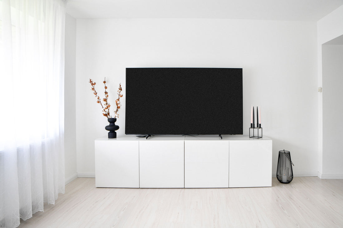 Minimalist white TV console in a bright Scandinavian-style living room