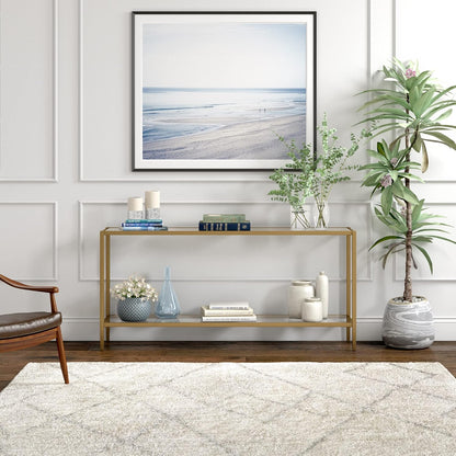 Henn&Hart 64" Wide Rectangular Console Table with Glass Shelf in Brushed Brass, Entryway Table